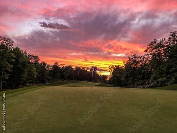 Fototapeta golf course at sunset
