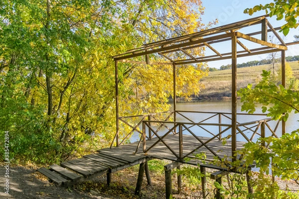Obraz Landscape with a house in autumn near the river