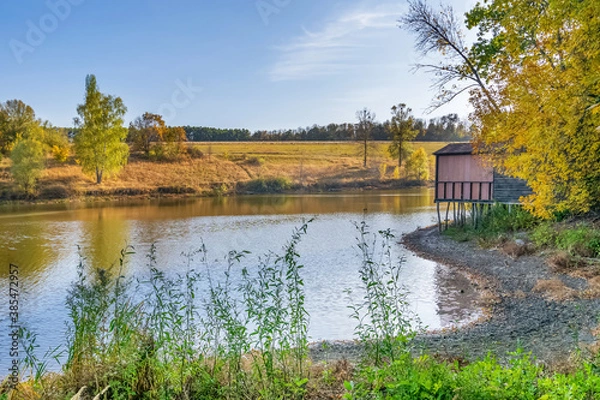Obraz Autumn landscape near the river with a house and a sunset