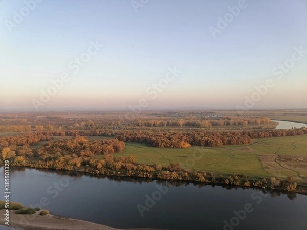 Fototapeta The view from the mountains to the White river in the fall