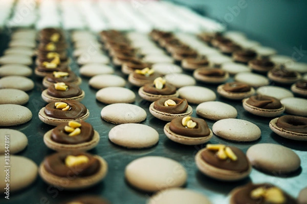 Fototapeta lots of macarons with peanut on metal table