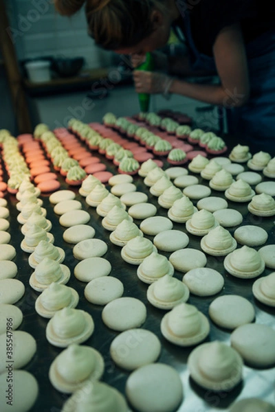 Fototapeta lots of macarons on metal table in pastry shop