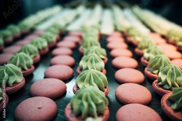 Fototapeta lots of macarons on metal table in pastry shop