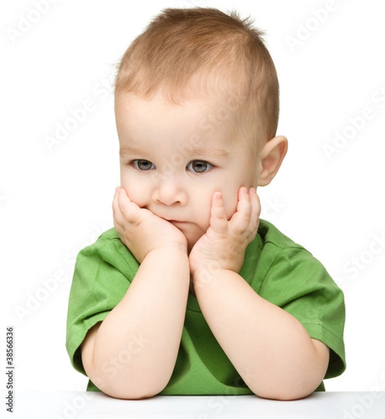 Fototapeta Pensive little boy support his head with hands