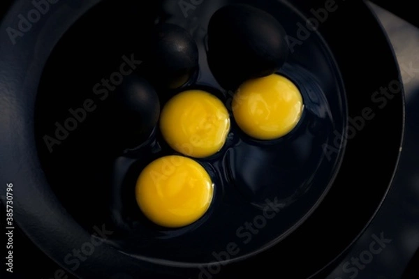 Obraz Black eggs with yolk