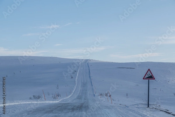Fototapeta snow covered road sign