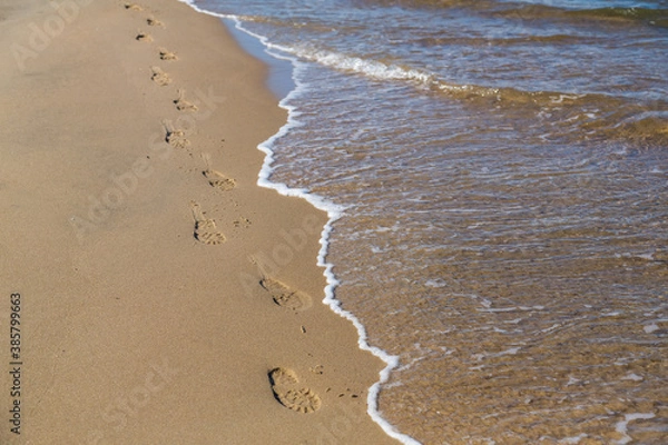 Fototapeta footprints on the beach