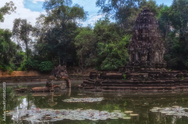 Obraz Neak Pean island temple with reflections and lotus flowers, Angkor temples complex, Siem Reap