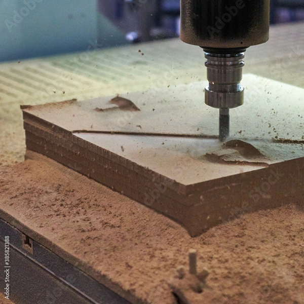 Fototapeta Processing of panels on the coordinate-milling woodworking machine with CNC.