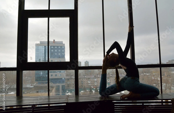 Obraz Young attractive woman practicing yoga near floor window, , working out. selective focus