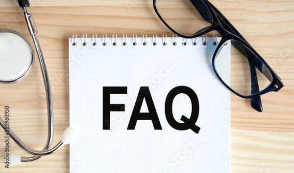 Fototapeta In the notebook, the text is faz, next to the glasses and the stethoscope. A medical concept.