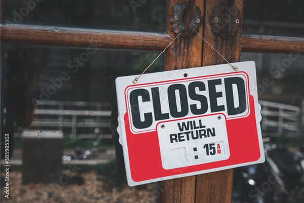 Fototapeta Text on white sign board  “Closed” infront of the mirror’s  shop with the boken yellow and green bright background. The mirror is dirty ,full of rusty and dusts.