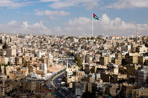 Fototapeta view of the city of Amman with Jordanian flags