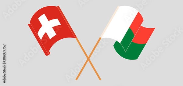 Obraz Crossed and waving flags of Madagascar and Switzerland