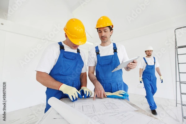 Fototapeta Workers at construction site
