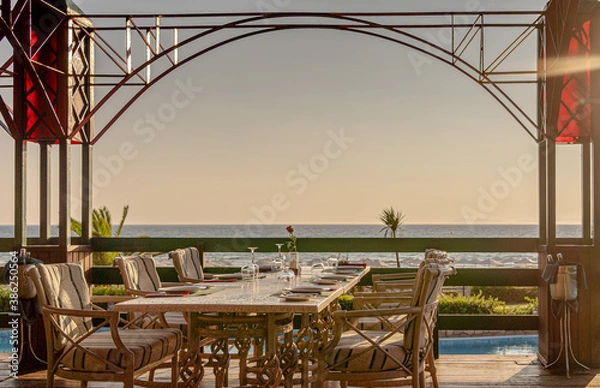 Obraz Served table in luxury restaurant with sea view.
