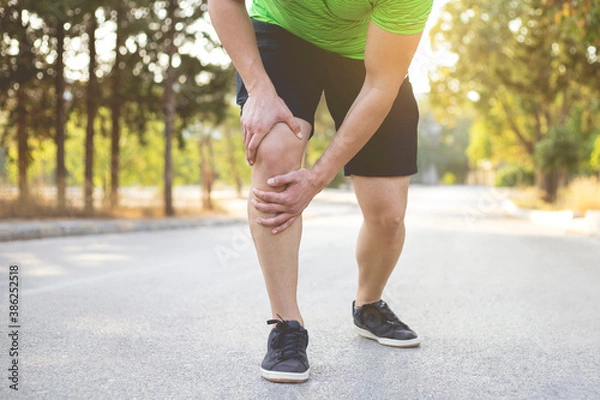 Fototapeta Running injury. Speed up before any exercise.