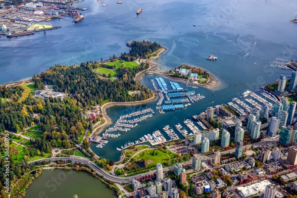 Fototapeta Aerial view of Coal Harbour and a modern Downtown City during a vibrant sunny morning. Taken in Vancouver, British Columbia, Canada.