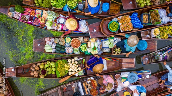 Obraz Aerial view famous floating market in Thailand, Damnoen Saduak floating market, Farmer go to sell organic products, fruits, vegetables and Thai cuisine, Tourists visiting by boat, Ratchaburi, Thailand