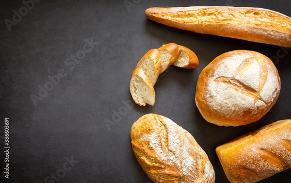 Fototapeta Assorted loaves homemade artisan bread. With copy space and space for text, banner