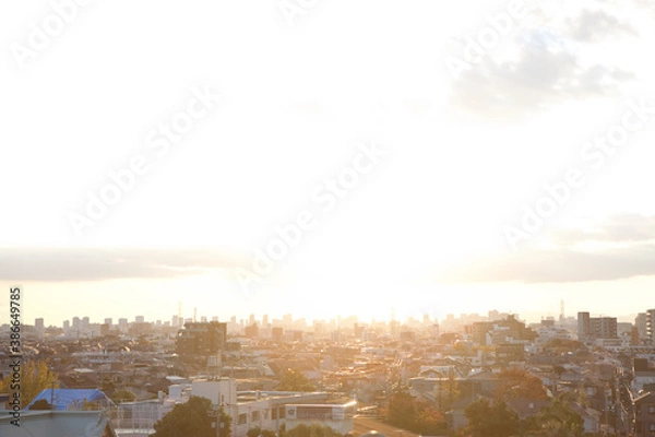 Fototapeta 夕陽に照らされる街