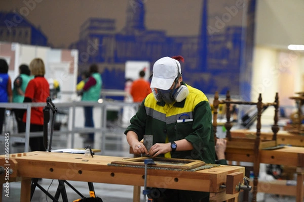 Obraz people in masks are working on projects indoors
