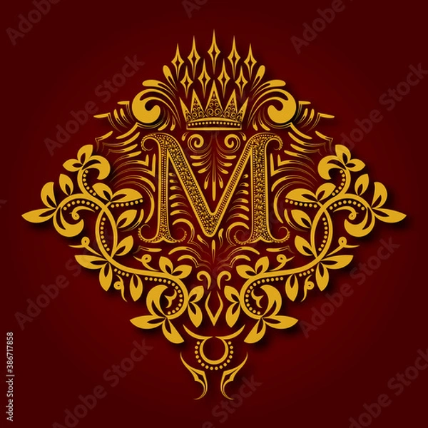 Fototapeta Letter M heraldic monogram in coats of arms form. Vintage golden logo with shadow on maroon background. Letter M is surrounded by floral elements of design.