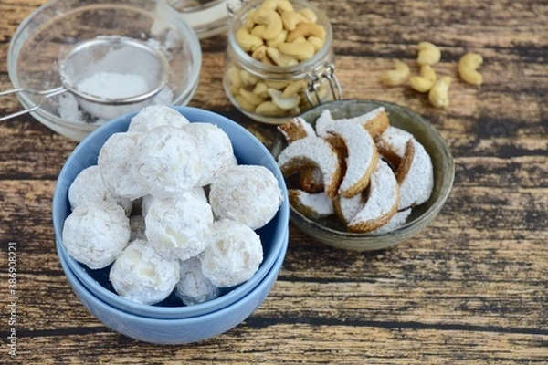 Fototapeta kue Putri salju (snow princess cookies or snow white cookies) is cute round and crescent shaped vanilla cookie with a crumbly, melt-in-your-mouth texture and covered in powdered sugar. 