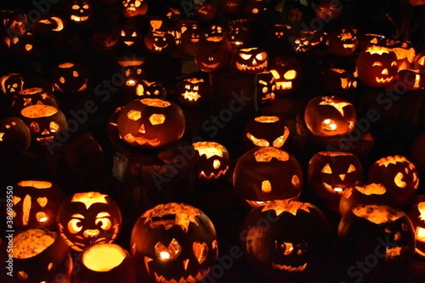 Obraz A jack-o'-lantern is a carved pumpkin turnip or other root vegetable associated with Halloween. The practice of carving spooky faces evolved into tradition its original idea to scare away evil spirits