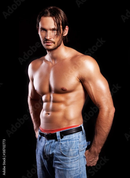 Obraz handsome powerful muscular man isolated on black