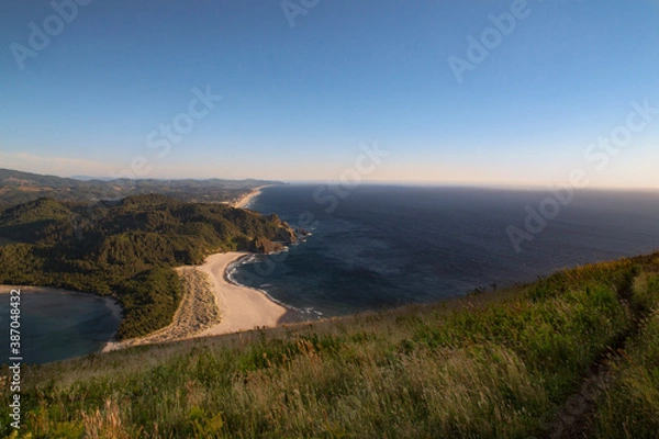 Fototapeta A view of the Oregon Coastal mountains and ocean toward the horizon as seen from the top of the Cascade Head Preserve