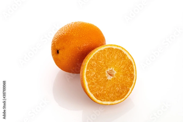Fototapeta Juicy orange with a half on a white background, isolate, close-up