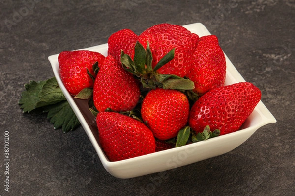 Fototapeta Ripe sweet strawberry with leaf