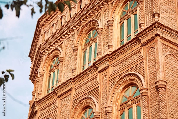 Obraz exotic building with beautiful arch window and fancy mosaic decoration in a desert town Xinjiang, China.