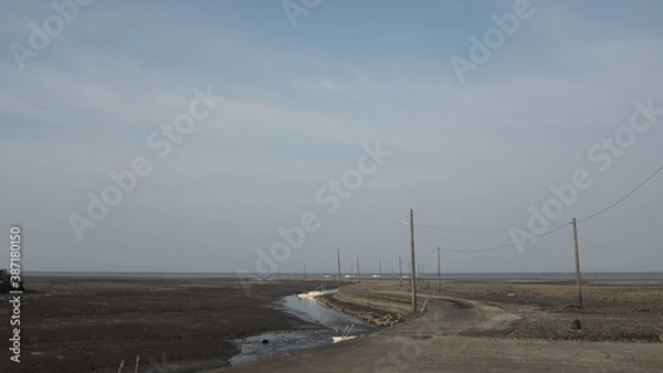 Obraz 海辺に並ぶ電柱