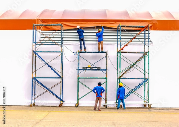 Fototapeta Technician install tensile fabric structure