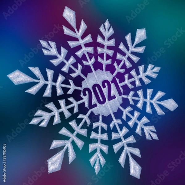 Obraz New Year 2021. Abstract snowflake on blurred background.