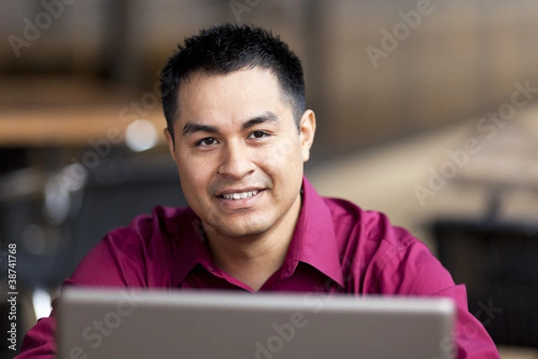 Obraz Hispanic Businessman - Telecommuting from Internet Cafe