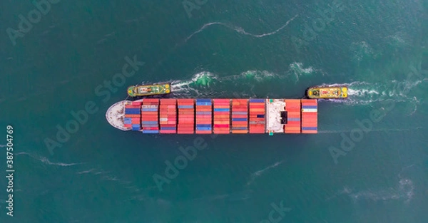 Fototapeta Aerial top view of cargo ship carrying container and running for export  goods  from  cargo yard port to custom ocean concept freight shipping by ship .