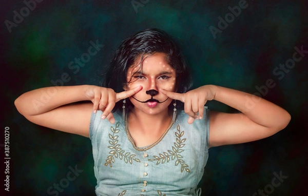Obraz Hands-on nose- Save the Deer Animal-Creative Portrait of a beautiful fashionable girl with facial expression 
