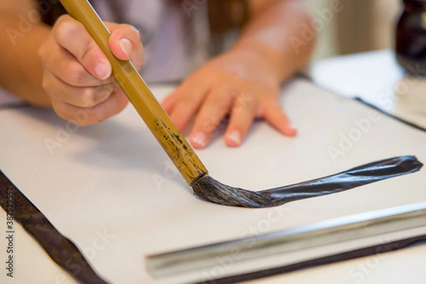 Fototapeta 習字をする女の子