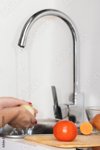 Obraz White kitchen with tomatoes in the foreground