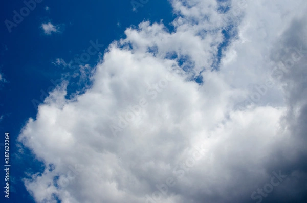 Obraz White clouds on a blue sky. Background.