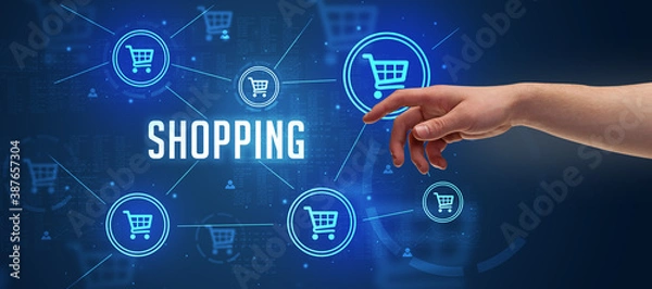 Fototapeta Close-Up of cropped hand pointing at SHOPPING inscription, online shopping concept
