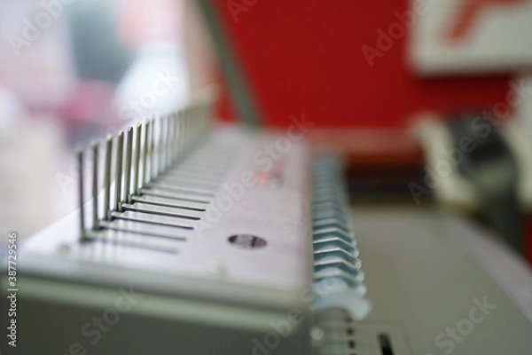 Fototapeta Book binding machine close up