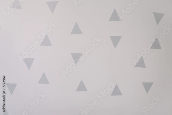 Fototapeta triangle wall stickers. white walls with decorations in a scandinavian style. interior details. copy space