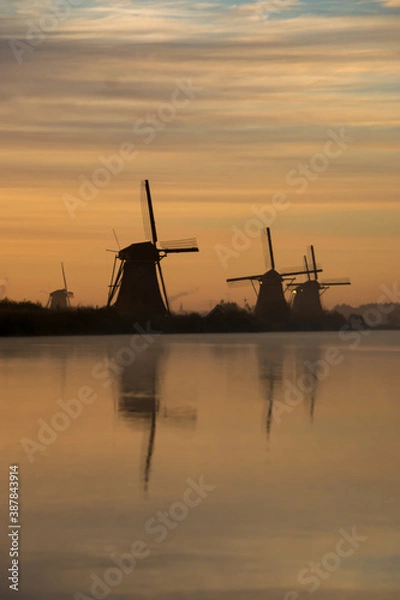 Fototapeta windmills at sunset