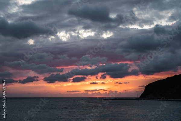 Fototapeta Black sea sunset in thunderclouds