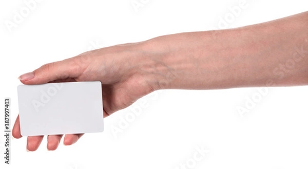 Obraz Female caucasian hands with blank business card isolated on white background. blank for designers
