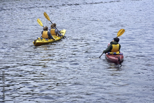 Fototapeta People kayaking in the lake